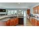Kitchen featuring stainless appliances, a breakfast bar, and wood floors at 2365 Valley Mill Dr, Buford, GA 30519