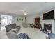 Cozy living room with a fireplace, ceiling fan and comfortable seating at 2365 Valley Mill Dr, Buford, GA 30519