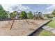 Community playground with swings and a climbing structure for children to enjoy at 2365 Valley Mill Dr, Buford, GA 30519