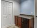 Cozy wet bar area with a mini-fridge and cabinet, perfect for entertaining guests at 2365 Valley Mill Dr, Buford, GA 30519