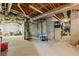 Unfinished basement featuring exposed pipes, water heaters, and plenty of storage space at 4004 Charrwood Trce, Marietta, GA 30062