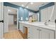 Bathroom with dual vanities, white cabinets, a large mirror, and tiled floors at 4004 Charrwood Trce, Marietta, GA 30062