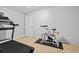 Bright exercise room with carpet, including a treadmill and stationary bike for in-home fitness at 4004 Charrwood Trce, Marietta, GA 30062