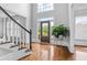 Bright foyer with hardwood floors, large windows, and elegant front door at 4004 Charrwood Trce, Marietta, GA 30062