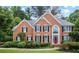 Beautiful brick home featuring manicured landscaping and a charming front entrance at 4004 Charrwood Trce, Marietta, GA 30062
