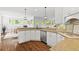 Well-lit kitchen with granite countertops, stainless steel appliances, and views to the dining area at 4004 Charrwood Trce, Marietta, GA 30062
