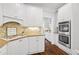 Gourmet kitchen featuring stainless steel appliances, granite countertops, and tile backsplash at 4004 Charrwood Trce, Marietta, GA 30062