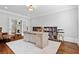 Spacious home office with hardwood floors, built-in shelving, and natural light at 4004 Charrwood Trce, Marietta, GA 30062