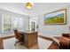 Bright home office with hardwood floors, a large desk, and comfortable seating at 4004 Charrwood Trce, Marietta, GA 30062