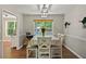 Elegant dining area featuring natural lighting, classic decor, and ample space for Gathering gatherings and entertaining guests at 6645 N Glen Dr, Cumming, GA 30028