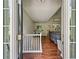 View of entryway with hardwood floors, and natural light streaming through large windows, creating a warm, inviting atmosphere at 6645 N Glen Dr, Cumming, GA 30028