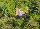 Birds-eye view of the home's roof and exterior, surrounded by mature trees at 1920 Jett Ridge Rd, Cumming, GA 30041