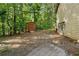 Backyard view with a wooden shed and lush green trees offering a serene escape at 1920 Jett Ridge Rd, Cumming, GA 30041