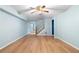 Basement with staircase, wood flooring, and ceiling fan at 1920 Jett Ridge Rd, Cumming, GA 30041