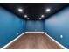 Finished basement with sleek floors, recessed lighting, and a modern design at 1920 Jett Ridge Rd, Cumming, GA 30041