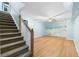 Basement with staircase, wood flooring, and beach scene wall art at 1920 Jett Ridge Rd, Cumming, GA 30041