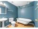 Bright bathroom with clawfoot tub and classic fixtures offers a vintage feel at 1920 Jett Ridge Rd, Cumming, GA 30041