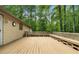 Expansive wooden deck with built-in seating providing an ideal outdoor living space at 1920 Jett Ridge Rd, Cumming, GA 30041