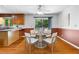 Bright dining area featuring a wood table with seating for four and a sliding door to the outside at 1920 Jett Ridge Rd, Cumming, GA 30041