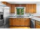Spacious kitchen with stainless steel appliances, wooden cabinets, and a double sink, offering modern convenience at 1920 Jett Ridge Rd, Cumming, GA 30041