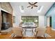 Bright and open living room featuring a stone fireplace, skylights and hardwood flooring at 1920 Jett Ridge Rd, Cumming, GA 30041