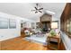 Bright living room with hardwood floors, a stone fireplace and a vaulted ceiling with skylights at 1920 Jett Ridge Rd, Cumming, GA 30041