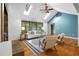 Spacious living room with hardwood floors, a stone fireplace, skylights and neutral decor at 1920 Jett Ridge Rd, Cumming, GA 30041