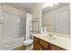 Standard bathroom featuring a shower-tub combo, single sink vanity and open rack shelving at 3379 Thornbridge Dr, Powder Springs, GA 30127
