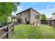 Spacious backyard featuring a covered patio, a play set, and green grass, offering plenty of room for outdoor activities at 4779 Bogan Meadows Dr, Buford, GA 30519