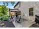 Outdoor patio and backyard area with patio furniture, a fire pit, and well-maintained landscaping at 4779 Bogan Meadows Dr, Buford, GA 30519