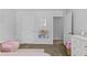 Bright bedroom with carpet and open closet that contains books at 4779 Bogan Meadows Dr, Buford, GA 30519