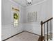 Welcoming entryway with hardwood floors, staircase and natural light at 4779 Bogan Meadows Dr, Buford, GA 30519