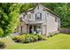 Beautiful home exterior showcasing manicured landscaping, stone accents, and a well-maintained lawn at 4779 Bogan Meadows Dr, Buford, GA 30519