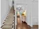 Bright foyer with hardwood floors, staircase, and decorative accents at 4779 Bogan Meadows Dr, Buford, GA 30519