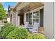 Inviting front porch with rocking chairs and decorative stone pillars at 4779 Bogan Meadows Dr, Buford, GA 30519