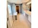 This is a bathroom featuring a tub with glass doors and a vanity with drawers at 6005 Pattingham Dr, Roswell, GA 30075
