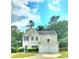 Charming two-story home with blue shutters and attached two-car garage at 6005 Pattingham Dr, Roswell, GA 30075