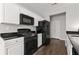 Modern kitchen with white cabinets and stainless steel appliances at 6005 Pattingham Dr, Roswell, GA 30075
