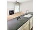 Kitchen island with sink and plenty of countertop space at 6005 Pattingham Dr, Roswell, GA 30075