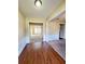 Open living space with hardwood floors and fresh carpeting to the other room at 6005 Pattingham Dr, Roswell, GA 30075