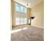 Spacious living room with large windows and soaring ceilings at 6005 Pattingham Dr, Roswell, GA 30075