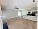 Open-concept living area with a fireplace and eat-in kitchen at 6005 Pattingham Dr, Roswell, GA 30075