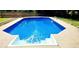 A rectangular in-ground pool filled with clear blue water and a ladder for exit and entry at 6005 Pattingham Dr, Roswell, GA 30075