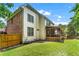 Home exterior showcasing a screened porch and spacious backyard at 1085 Highland Crest Ct, Mableton, GA 30126