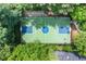 Aerial view of an outdoor basketball court surrounded by trees, providing a recreational space for sports at 1085 Highland Crest Ct, Mableton, GA 30126