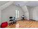 Bright bedroom with hardwood floors and a window with white shutters at 1085 Highland Crest Ct, Mableton, GA 30126