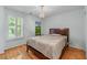 Bedroom with a bed, hardwood floor, natural light, and neutral wall color at 1085 Highland Crest Ct, Mableton, GA 30126