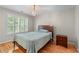 Bedroom with a bed, hardwood floor, and natural light at 1085 Highland Crest Ct, Mableton, GA 30126