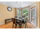 Breakfast nook with hardwood floors, modern chandelier, and views of the backyard at 1085 Highland Crest Ct, Mableton, GA 30126