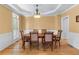 Bright dining room features hardwood floors, elegant lighting, and ample seating for six at 1085 Highland Crest Ct, Mableton, GA 30126